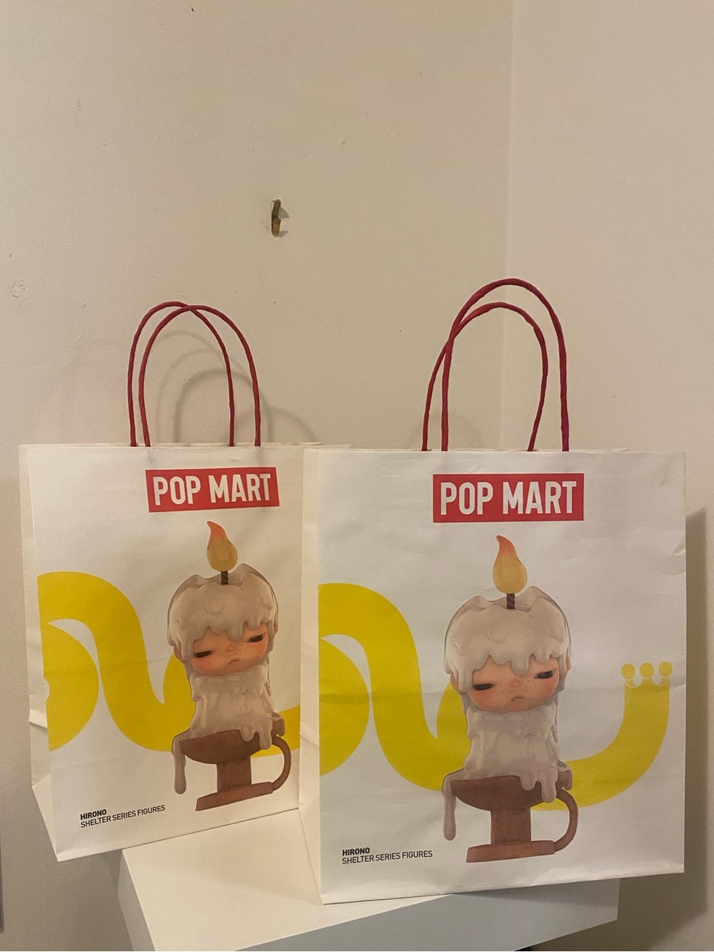 2 POP MART White Gift Bags with Yellow Graphic and Red Handles
